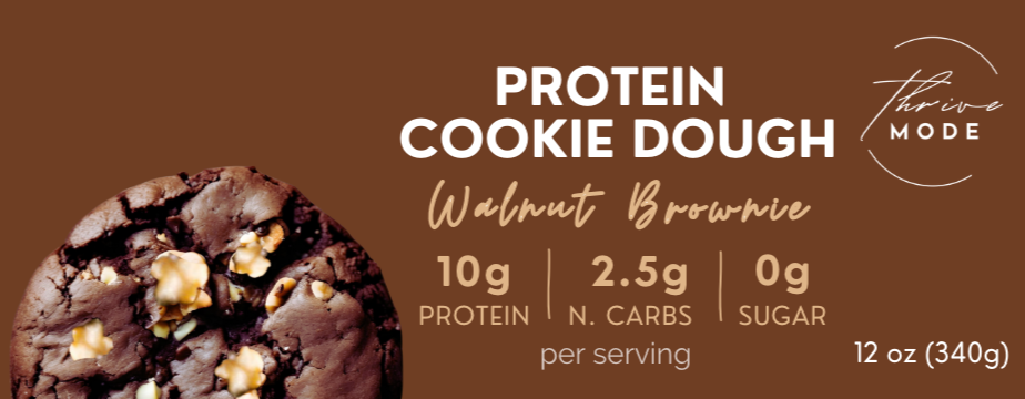 Protein cookie dough packaging with a walnut brownie flavor on a brown background.