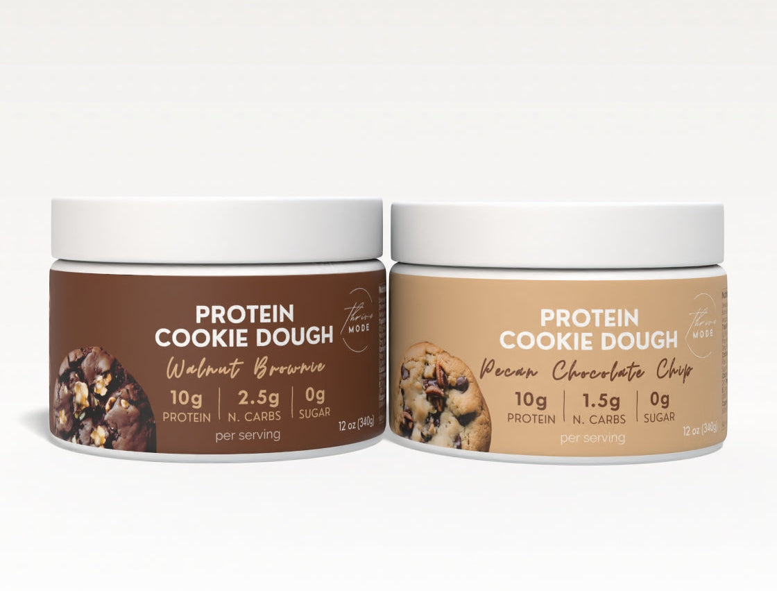 Two containers of Protein Cookie Dough on a white background
