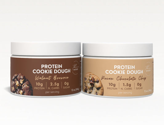 Two containers of Protein Cookie Dough on a white background